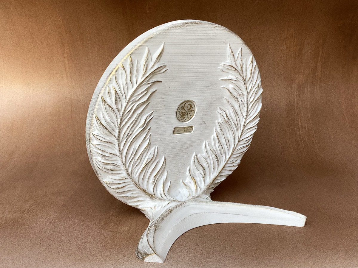 Back view of freestanding Jesus Christ bas-relief with palm leaf stand structure