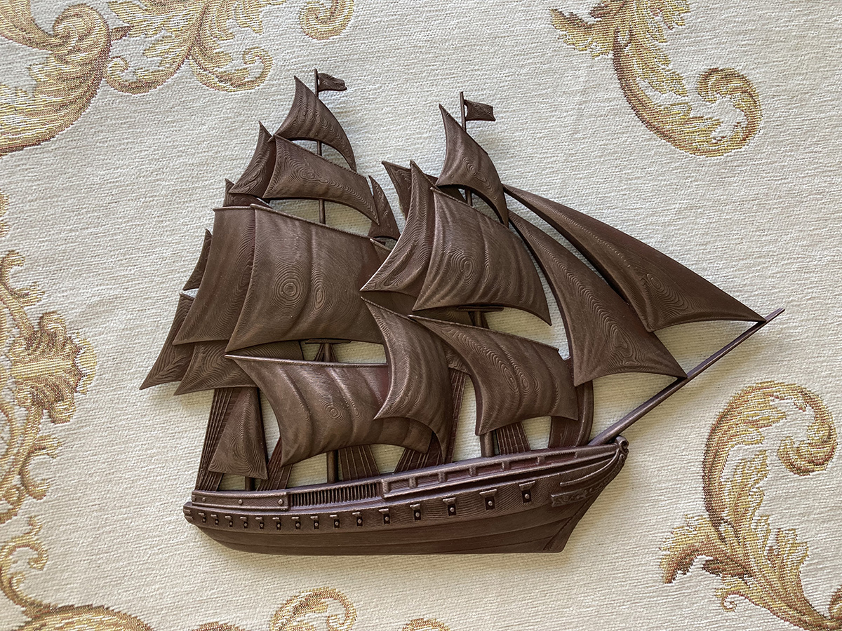 Sailing ship bas-relief sculpture designed as a wall-mounted decorative object with detailed sail composition and layered structure