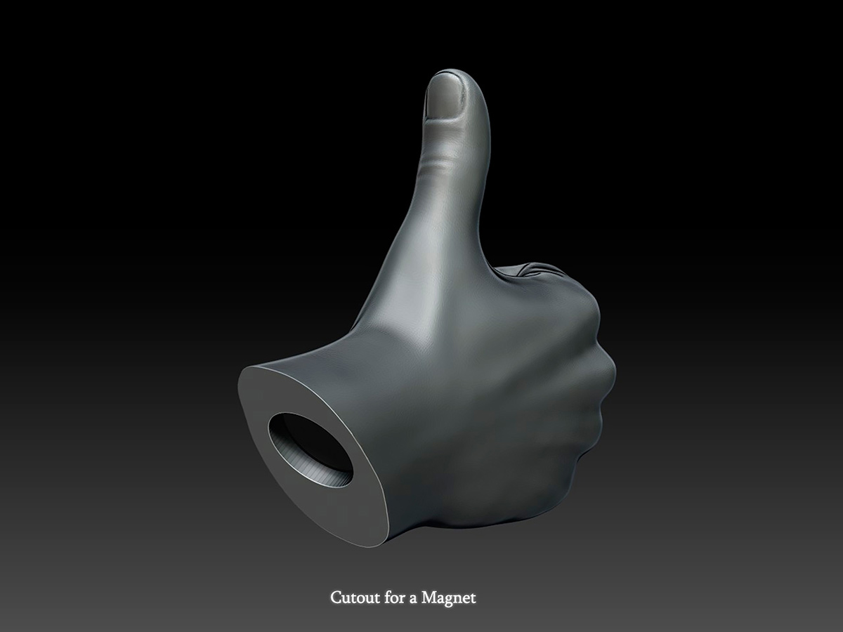 Digital thumbs up hand sculpture showing circular cutout for embedded neodymium magnet, functional design concept